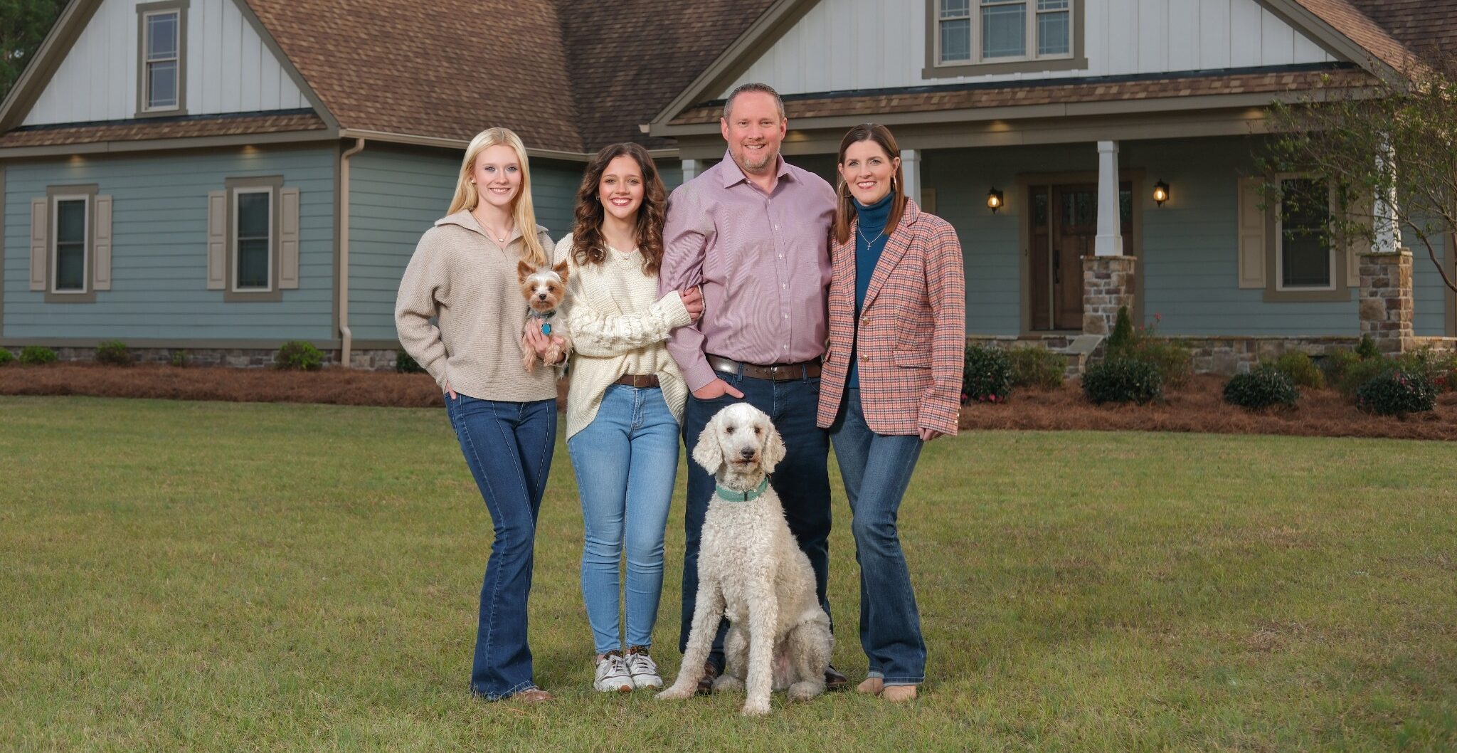BJ Murphy with Jessica, Gracyn and Kathryn outside their home